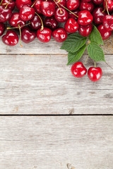 Wall Mural - Ripe cherries on wooden table