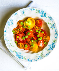 Wall Mural - Colorful tomatoes with onion