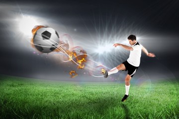 Poster - Composite image of football player in white kicking