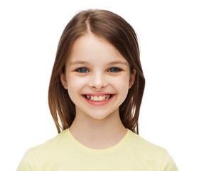 smiling little girl over white background