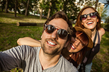 Three Young People Taking Selfie