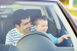 Fototapeta  - Father and son driving car