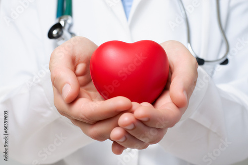 Doctor protecting a heart Fototapeta