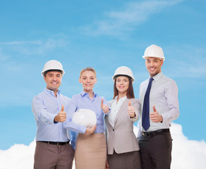 Wall Mural - happy business team in office showing thumbs up