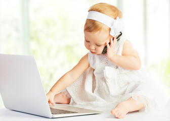 baby girl at laptop computer, mobile phone