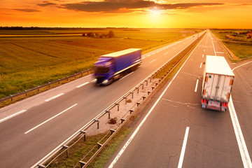 Poster - Blue and white truck in motion blur on the highway