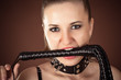 Portrait of mistress with a whip in the mouth
