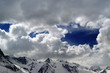 Snowy mountains in beautiful clouds