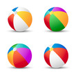 Colorful beach balls isolated on white with shadow.