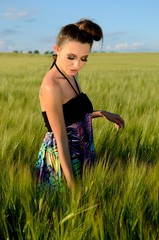 Young girl in green fields