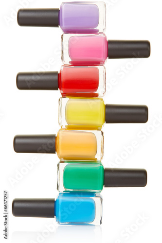 Photographie Nail polish bottles colorful stack on white, clipping path