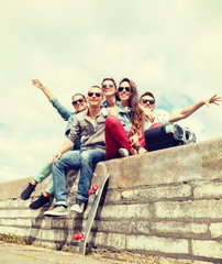 Wall Mural - group of smiling teenagers hanging out