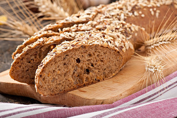 Slices of finest organic bread decorated with natural cereals