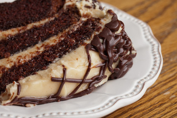 Slice of layered whipped peanut butter and chocolate cake