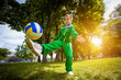© Dmytro Titov - little boy having fun playing soccer with ball