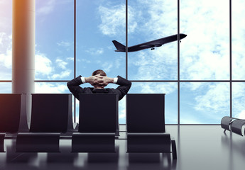 Wall Mural - businessman sitting in airport