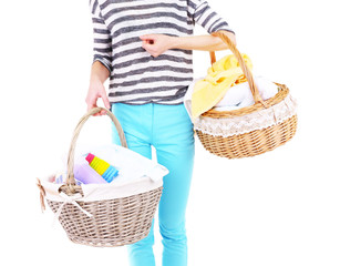 Wall Mural - Woman holding laundry baskets with clean clothes, towels and