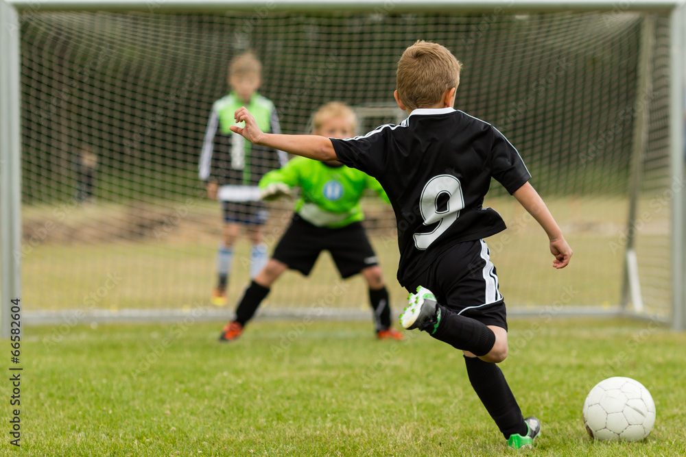 Kids soccer penalty kick - obrazy, fototapety, plakaty 