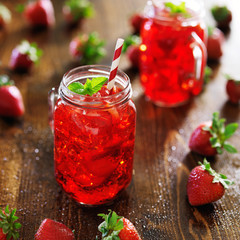 Wall Mural - strawberry cocktail in jar with deep red color