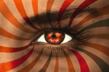 Fototapete - Orange eye on patterned face