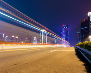 light trails on the modern city street at night