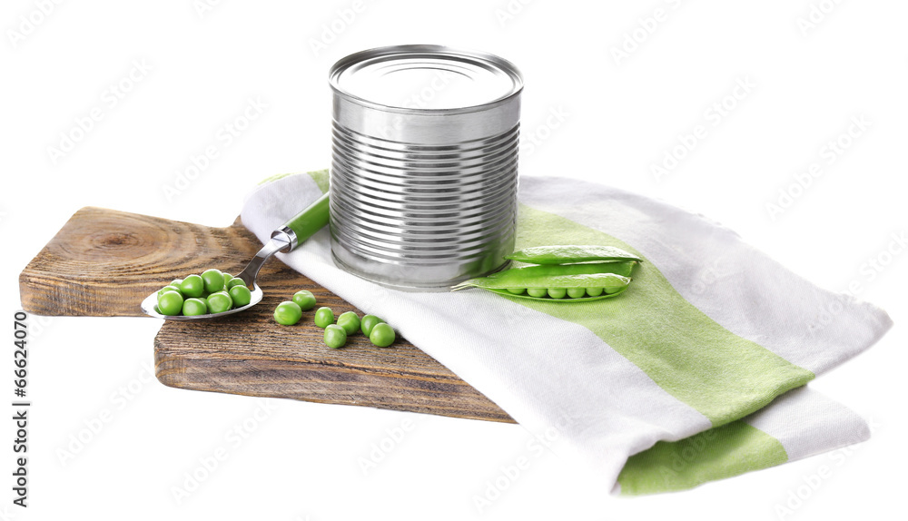 Fresh peas and tin on wooden board, isolated on white