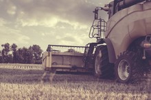 Combine Harvester On A Wheat Field - Vintage Styel