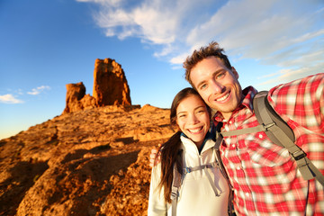 Selfie - Happy couple taking self portrait hiking