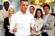 © Drobot Dean - Happy businessman standing with thumbs up