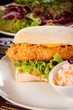 © juniart - Burger with golden crumbed chicken breast