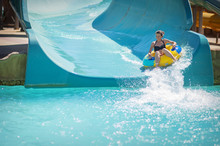 Beautiful Girl Pulls Off The Slides At The Water Park