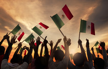 Group Of People Holding National Flags Of Mexico