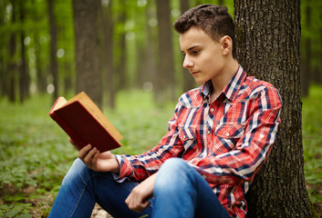 Teenager reading a book