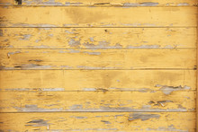 Old Planks With Peeling Yellow Paint