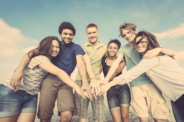 Multiracial Group of Friends with Hands on Stack