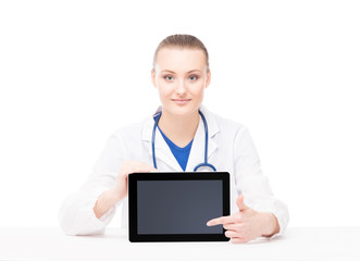 Wall Mural - Young and professional woman doctor with an tablet