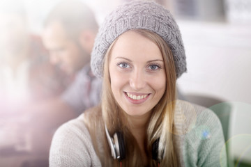 Fototapete - Beautiful student girl wearing hat in class
