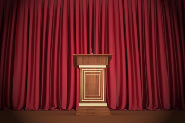 Podium and microphone in center of theatrical stage