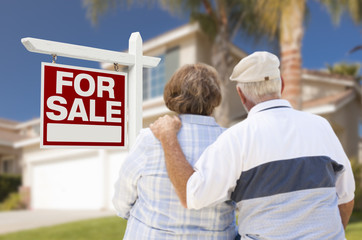 Wall Mural - Happy Senior Couple Front of For Sale Sign and House