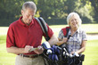 © Monkey Business - Senior couple on golf course