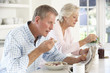 © Monkey Business - Retired couple eating breakfast