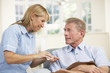 © Monkey Business - Senior man visited at home by nurse