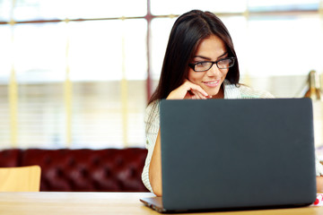 Sticker - Happy businesswoman working on the laptop at office