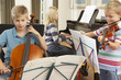 © Monkey Business - Children playing musical instruments at home