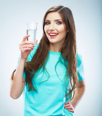 Wall Mural - Casual style young woman posing on isolated studio background,