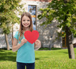 © Syda Productions - smiling little girl with red heart