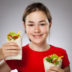 Wall Mural - Girl eating big sandwich