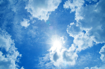 Wall Mural - blue sky with clouds and sun.