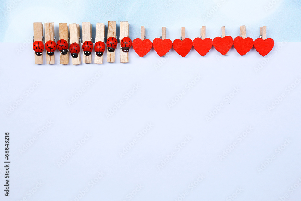 Abstract background with colorful wooden pins and paper