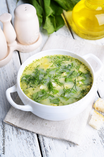 Fototapeta na wymiar Delicious green soup with sorrel on table close-up